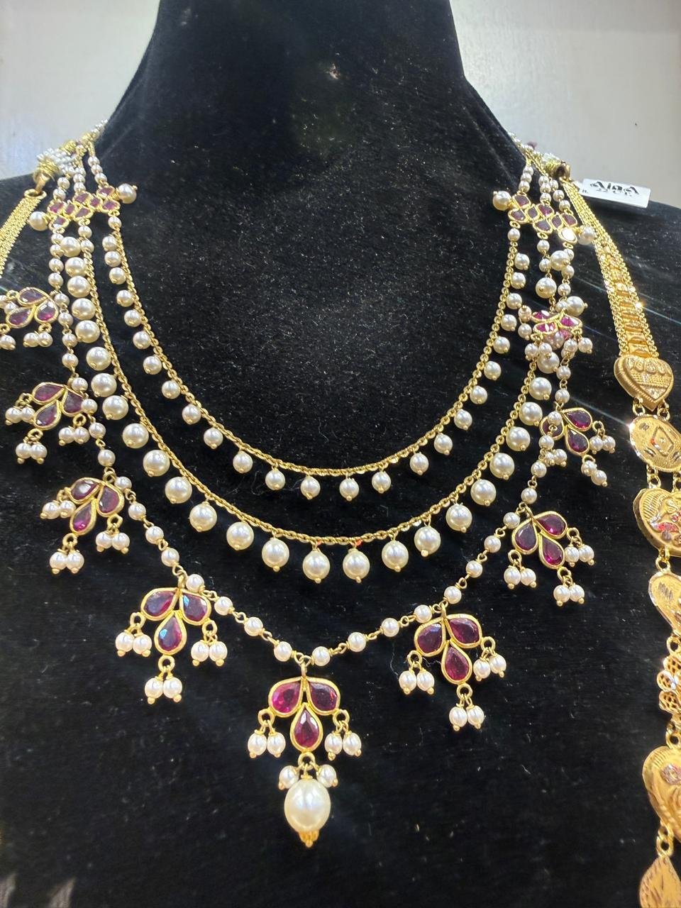 A multi-strand pearl and ruby bridal necklace