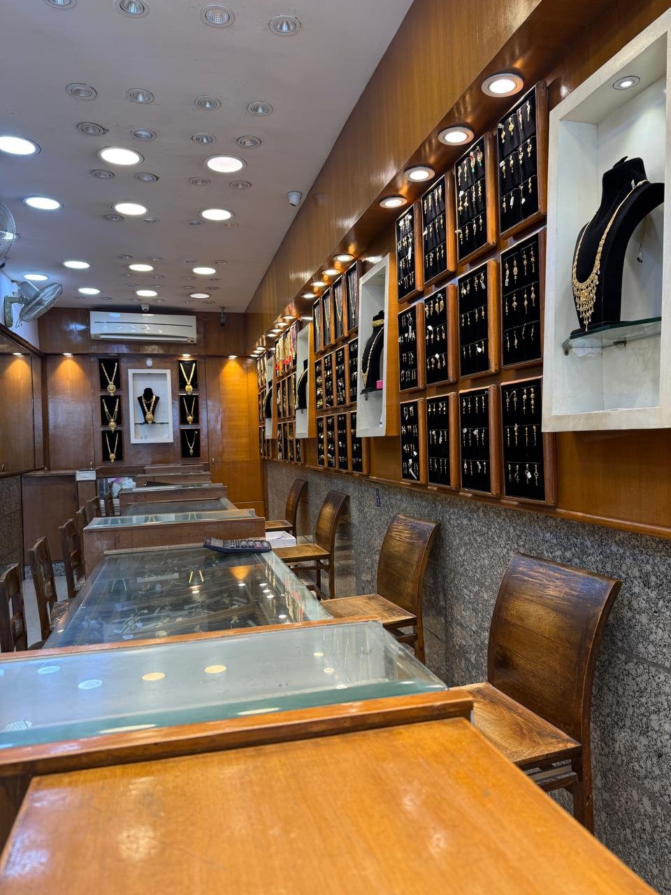 A wide view of the Aina Gold showroom interior